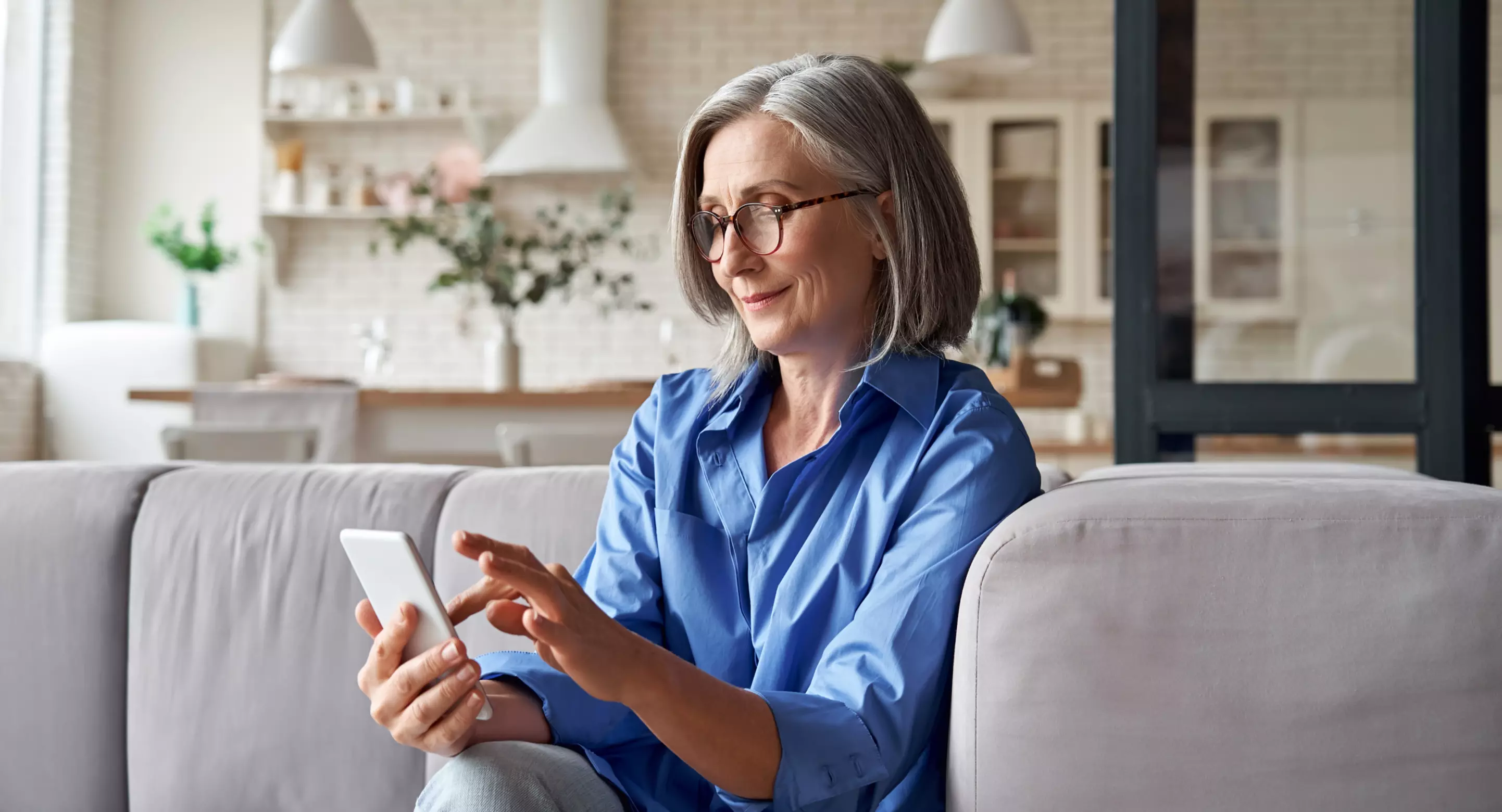 An older woman using a smartphone.