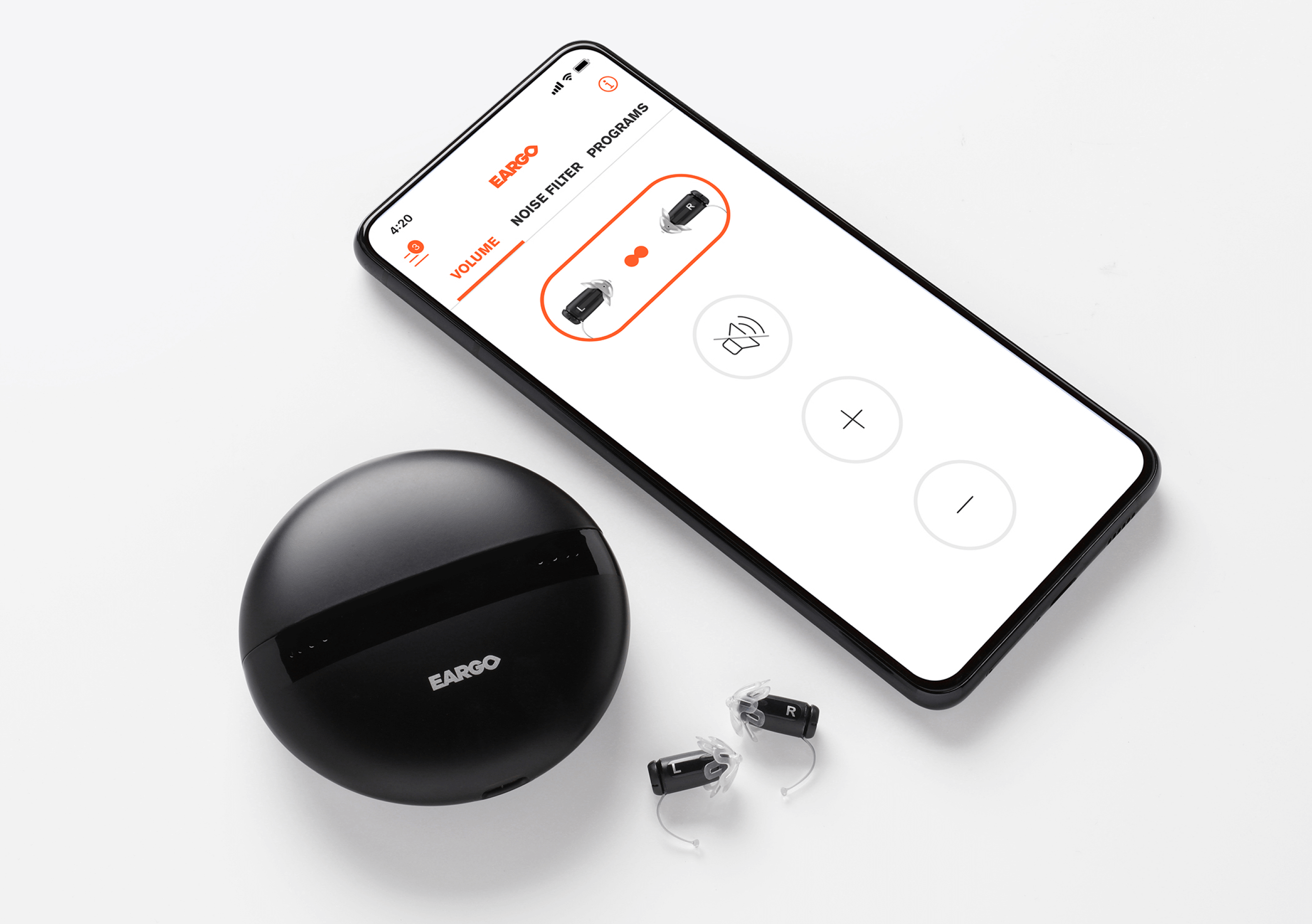 Eargo smart hearing aid next to a smartphone with an Eargo app on.
